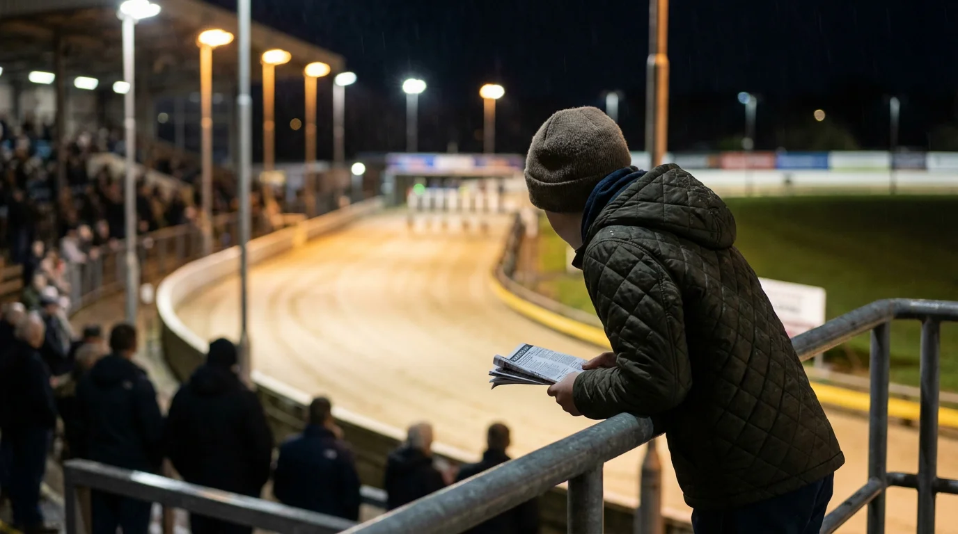 Beginner studying a greyhound race card at a UK track on race night