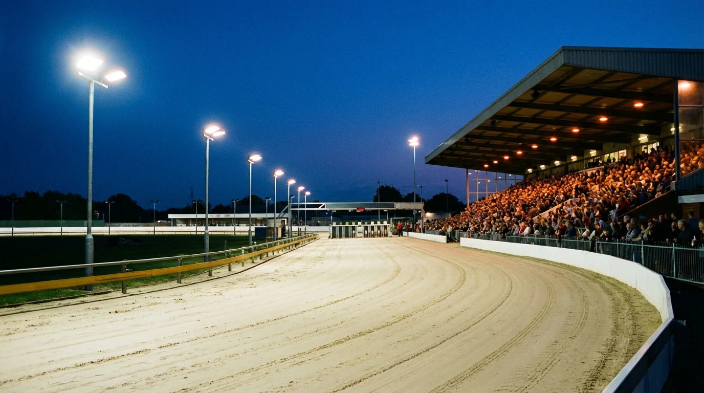 Greyhound Derby final night atmosphere at Towcester Stadium with floodlit sand track